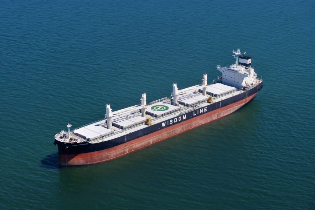 Aerial view of a bulk carrier ship at sea transporting agricultural commodities from Brazil to international markets