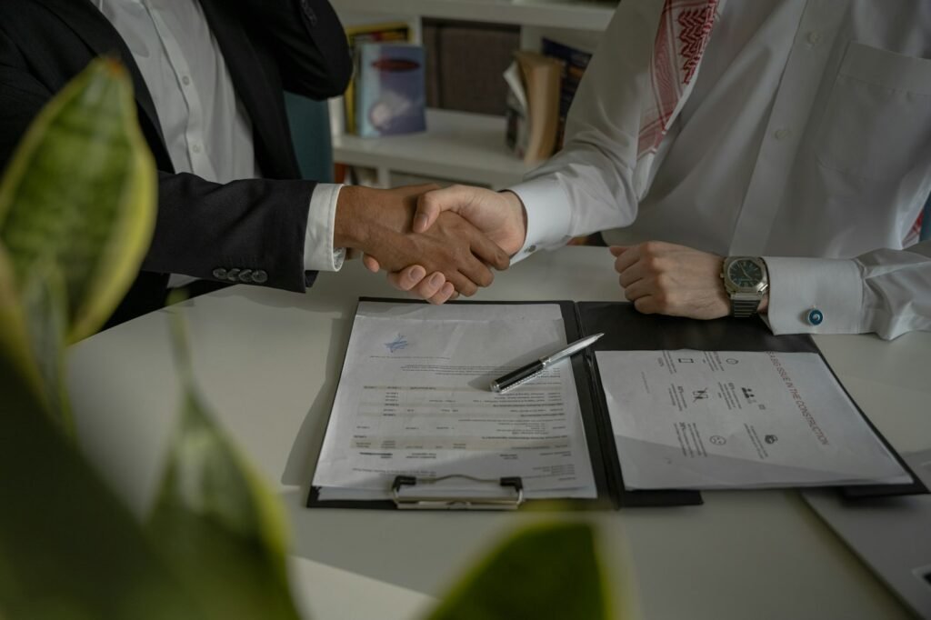 Business partners reviewing an export contract and trade documents for an agricultural commodity transaction