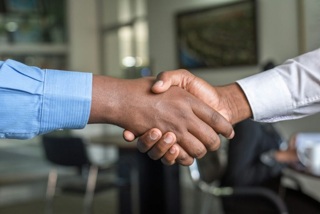 Business handshake between a commodity buyer and supplier – long-term international trade partnership